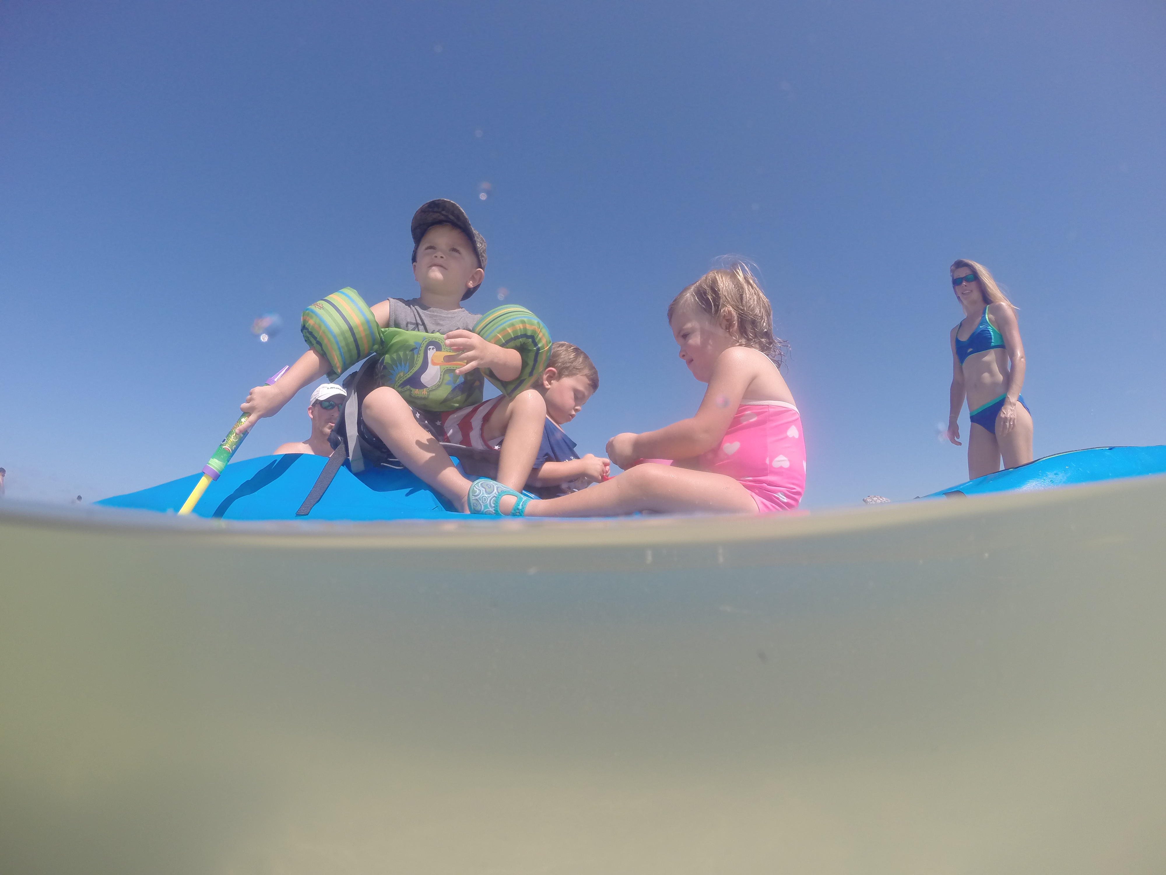 toddlers enjoying themselves on a Perception kayak