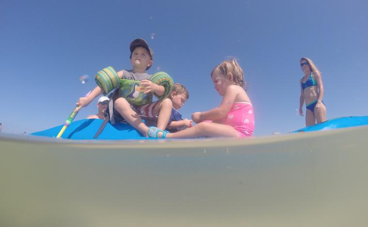 toddlers enjoying themselves on a Perception kayak