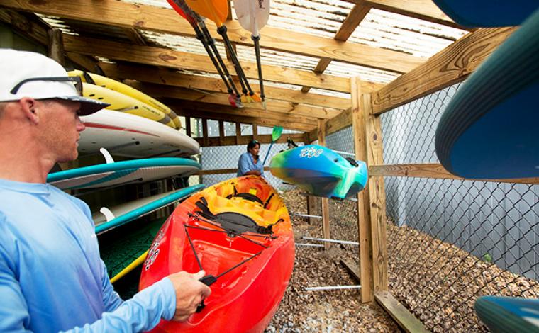 kayaks in shed